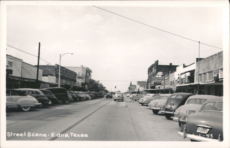 Downtown Edna, Texas Street Scene with Businesses and Parked Cars
