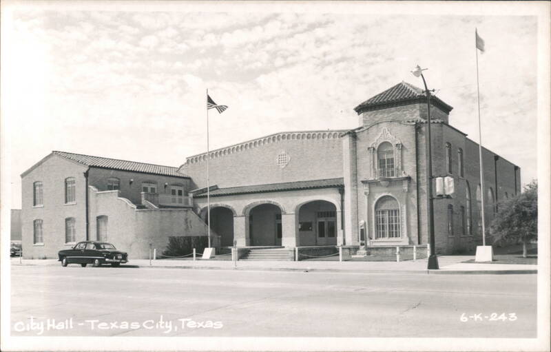 City Hall building with arched entrance and flags Texas City