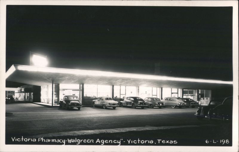 Victoria Pharmacy-Walgreen Agency at Night with Cars Texas