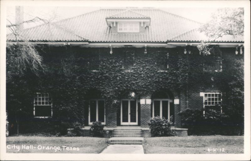 City Hall building with ivy-covered facade and tiled roof Orange Texas