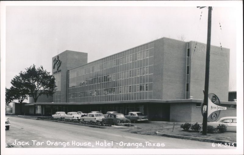 Jack Tar Orange House Hotel with Cars in Parking Lot Texas