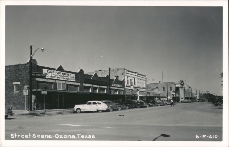 Downtown Ozona Street Scene with Businesses and Parked Cars Texas