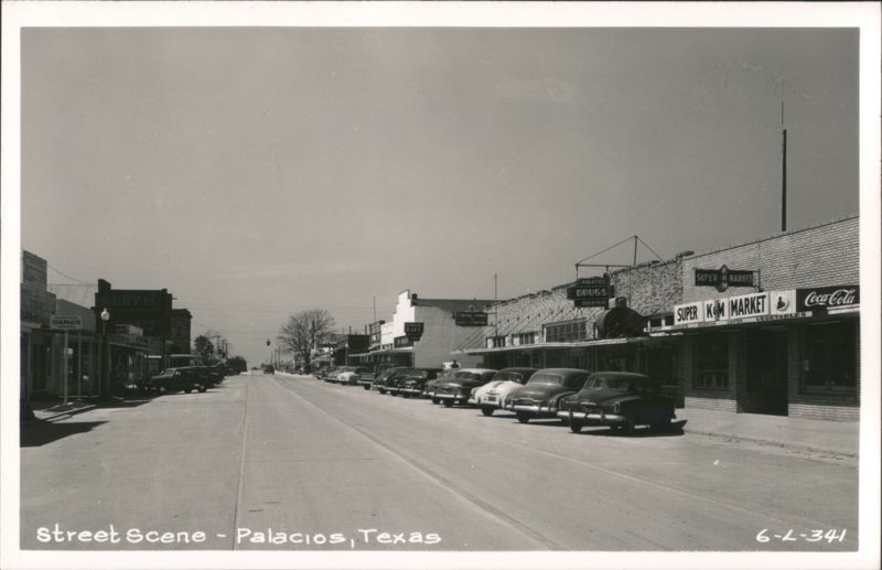 Street Scene in Palacios, Texas with businesses and parked cars