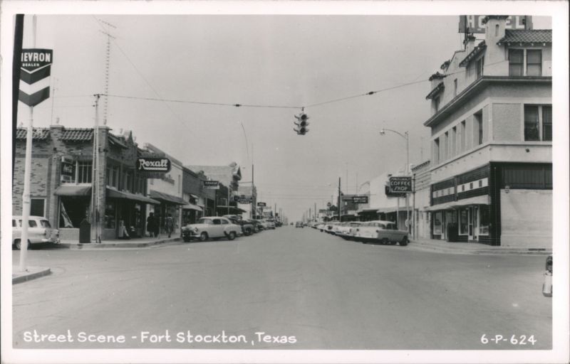 Downtown Street Scene with Shops and Parked Cars Fort Stockton Texas