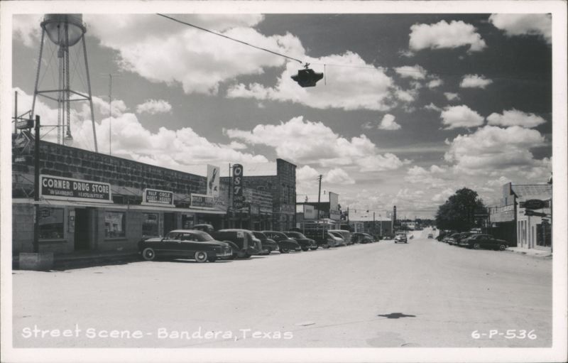 Street Scene with Corner Drug Store, Water Tower & Vintage Cars Bandera Texas