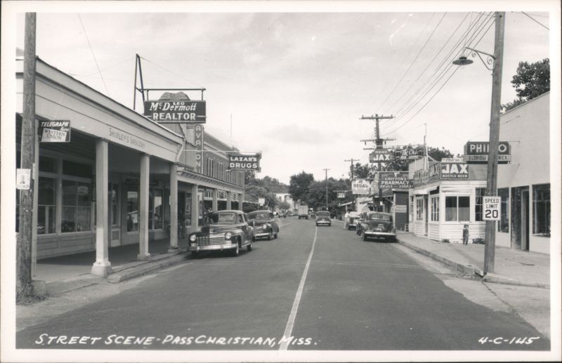 Downtown Street View with Shops and Vintage Cars Pass Christian Mississippi