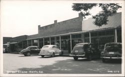 Street Scene with Vintage Cars and Businesses Postcard