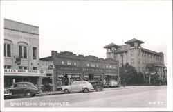 Street Scene with Hill's Drug Store, Rose's, and Park Terrace Hotel Postcard