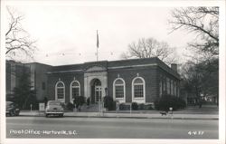 Post Office building with arched windows and entrance Postcard