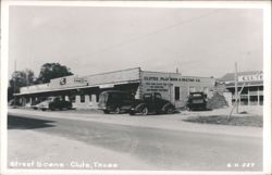 Street Scene with Clutex Plumbing & Heating Co. and Clute Cleaners Postcard