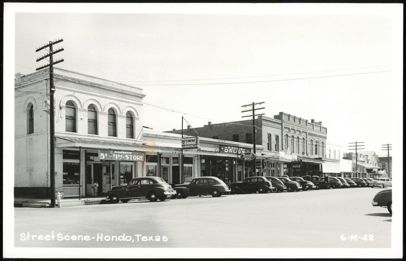 Downtown Street Scene with Stores and Parked Cars Hondo Texas