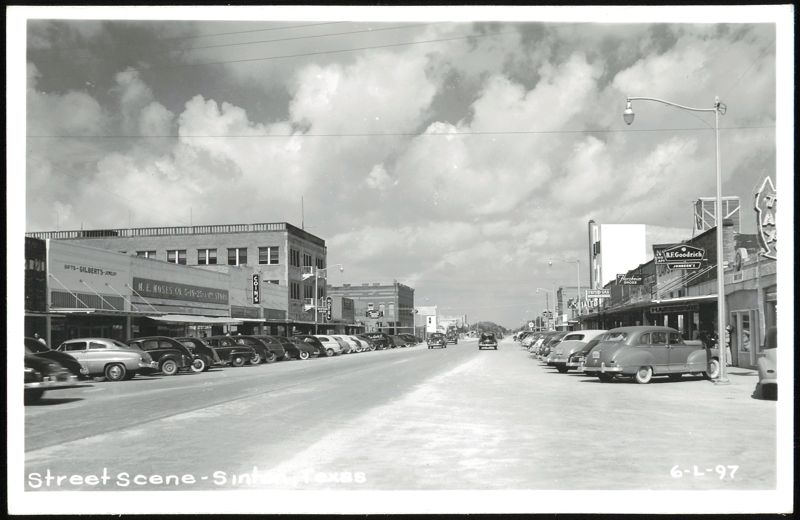 Street Scene with Storefronts and Parked Cars Sinton Texas