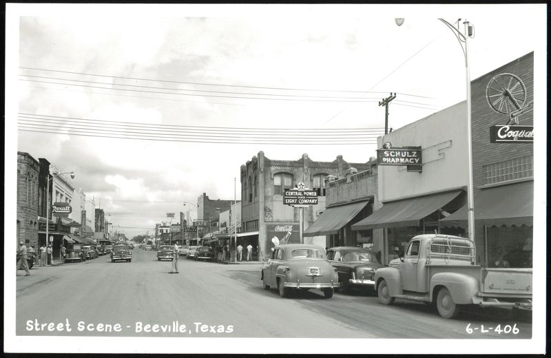 Beeville, Texas Street Scene with Rexall and Schultz Pharmacy
