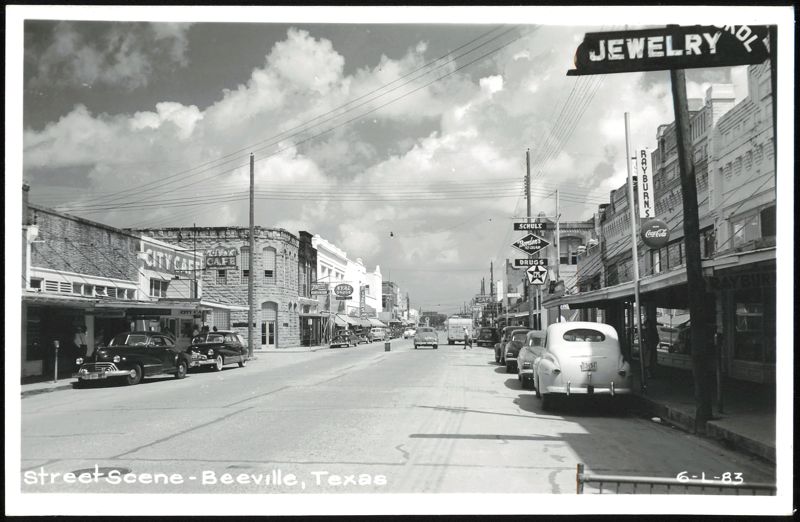 Street Scene with Businesses and Vintage Cars Beeville Texas