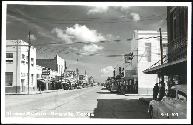Street Scene with Businesses, Cars, and Pedestrians Beeville Texas