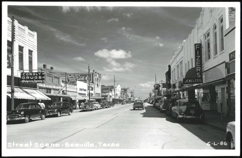 Street Scene with Businesses and Cars, Beeville Texas