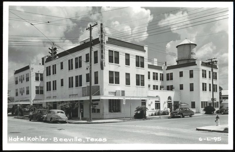 Hotel Kohler, Beeville, TX with vintage cars and water tower Texas