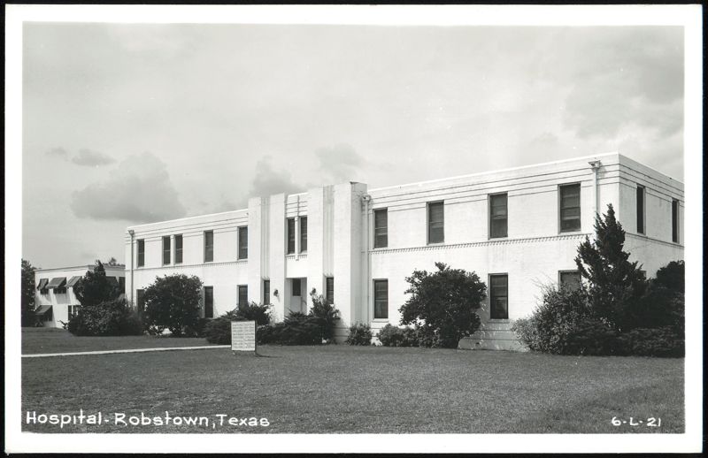 White brick Hospital building with lawn and trees Robstown Texas