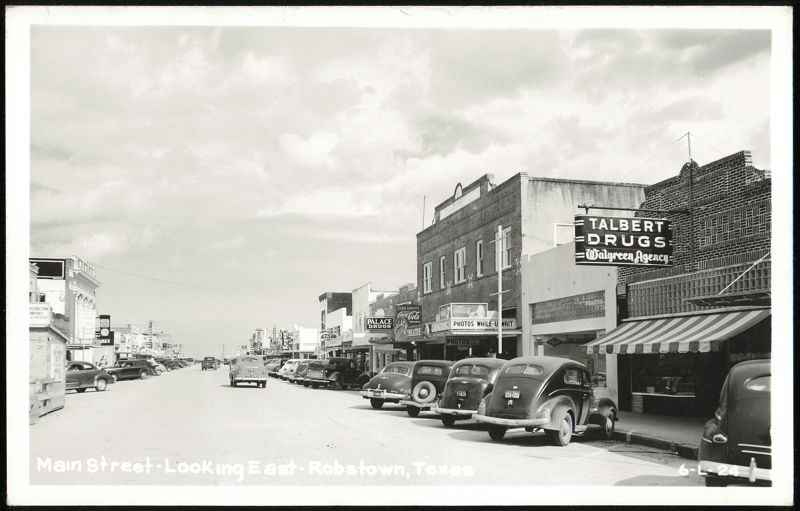 Main Street Looking East with Talbert Drugs, vintage cars Robstown Texas