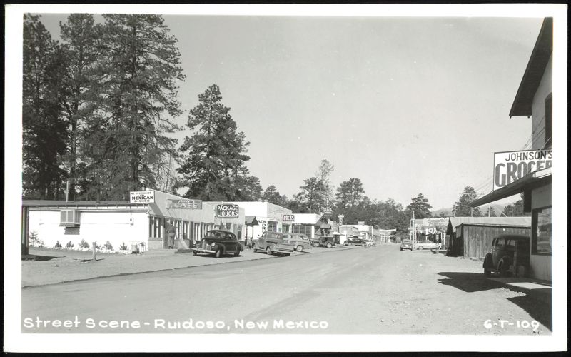 Street Scene with Shops, Cars, and Pine Trees, Ruidoso New Mexico