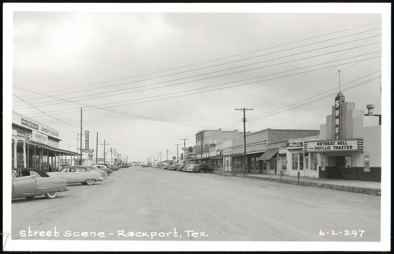Street scene with Surf Theater, Johnson's Drug Store, and businesses Rockport Texas