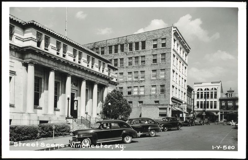 Street Scene with Classical Building, Brick Building, and Vintage Cars Winchester Kentucky