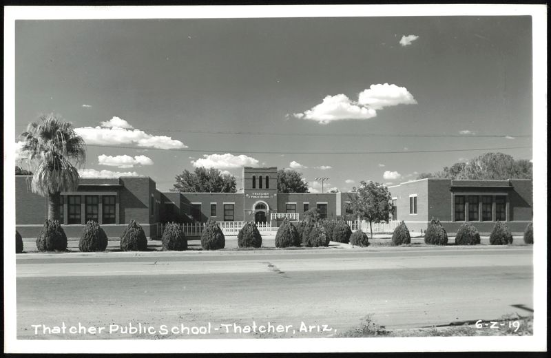 Thatcher Public School Building with Palm Tree and Clouds Arizona