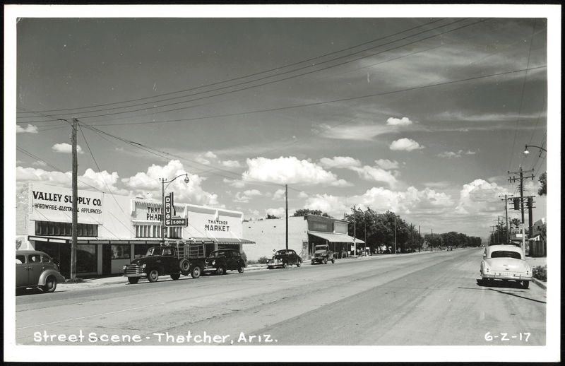 Street Scene with Valley Supply, Pharmacy, Market, and Cars Thatcher Arizona