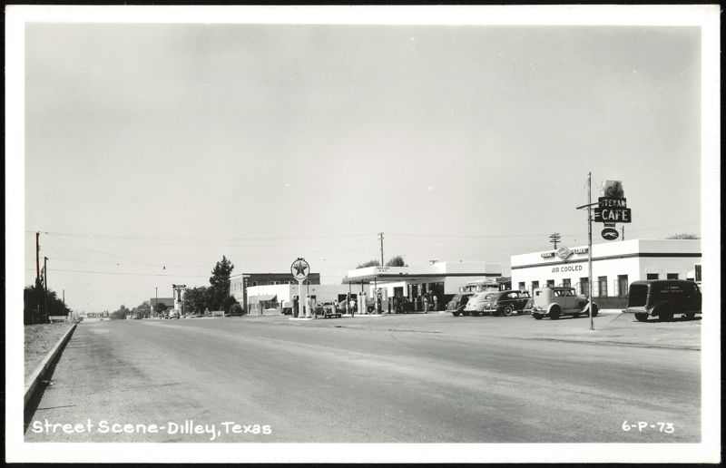 Street Scene with Texan Cafe and Texaco Station, Dilley, TX Texas