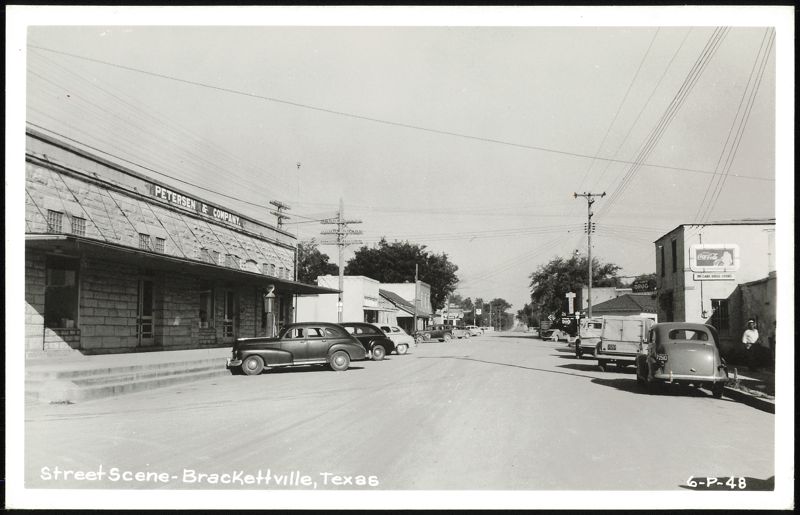 Street Scene with Petersen & Company and McCabe Drug Store Brackettville Texas