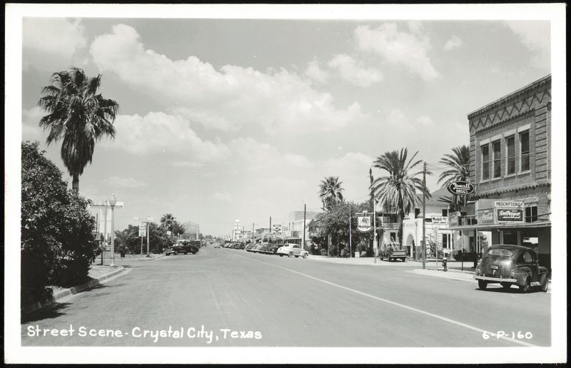 Downtown Street Scene with Palm Trees, Rexall Drugs, and Mobilgas Crystal City Texas