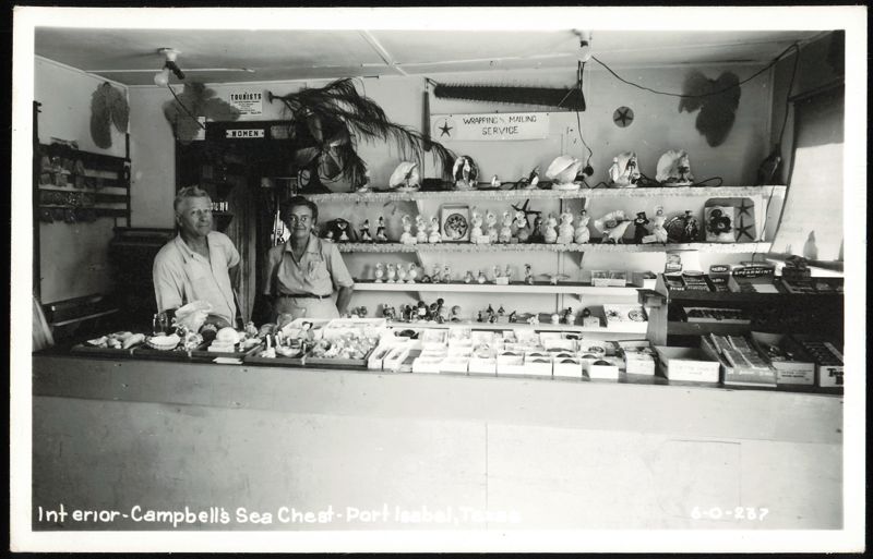 Interior of Campbell's Sea Chest store with two clerks Port Isabel Texas
