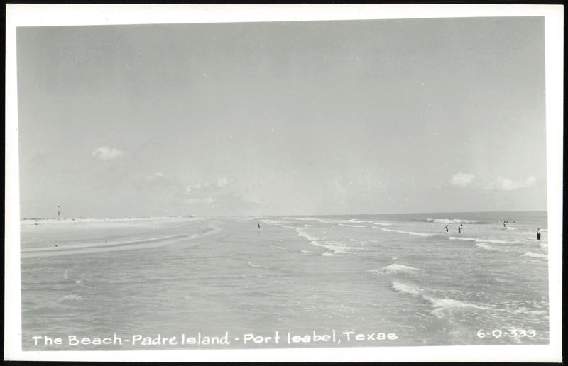 Beach scene with people in the water, Padre Island Port Isabel Texas