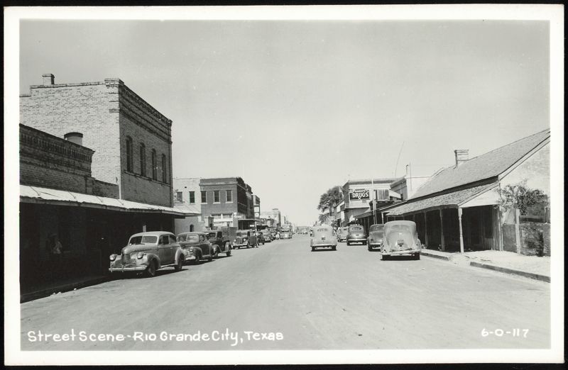 Street Scene with Cars and Margo's Drugs Rio Grande City Texas
