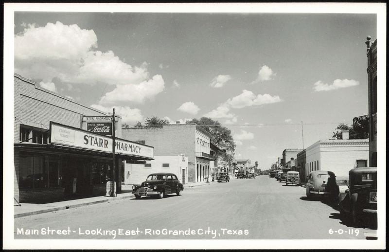 Main Street Looking East with Starr Pharmacy and Vintage Cars Rio Grande City Texas