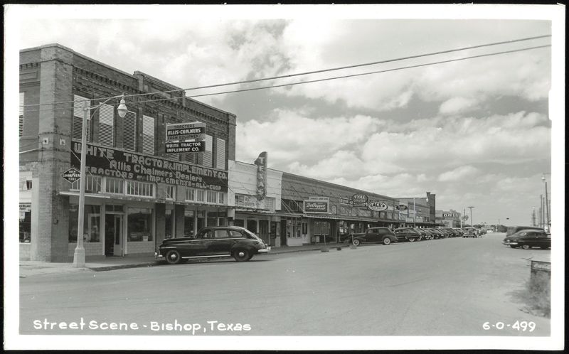 Street Scene, Main Street with Businesses and Parked Cars Bishop Texas