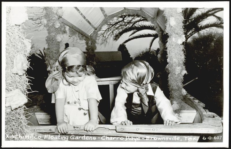 Two children in Xochimilco Floating Gardens during Charro Days Brownsville Texas