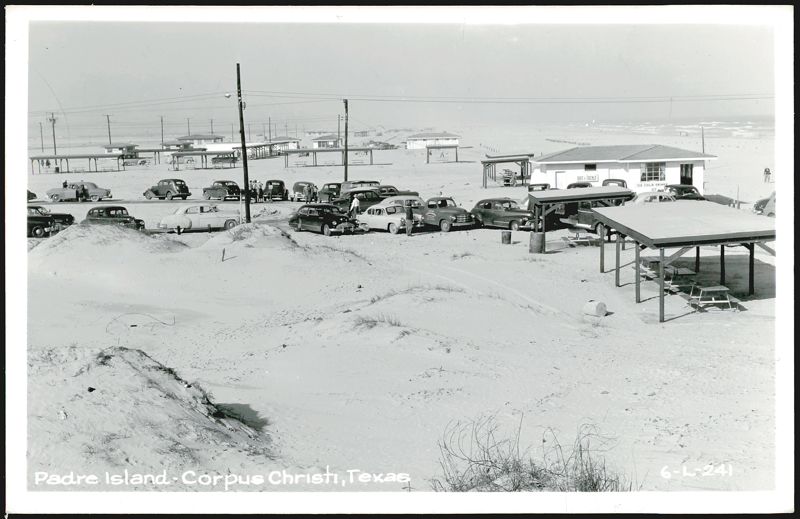 Padre Island Beach with Cars, Buildings, and Picnic Shelters Corpus Christi Texas