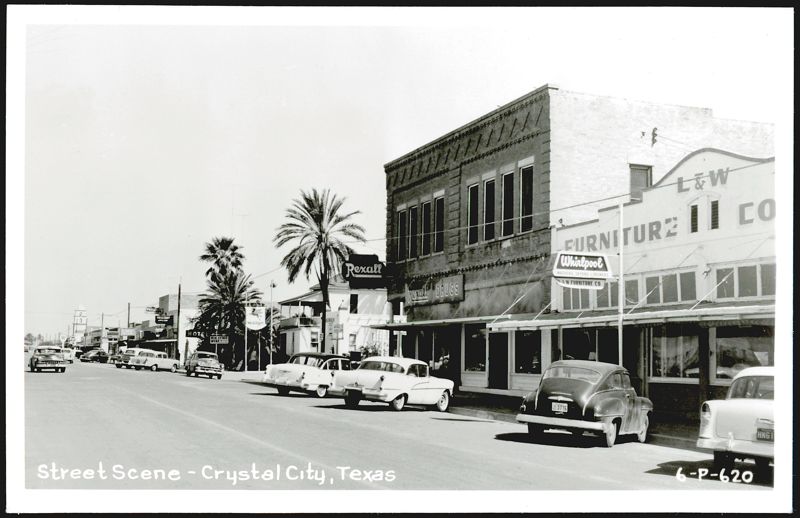 Street Scene with Rexall Drugs and L&W Furniture, Crystal City Texas