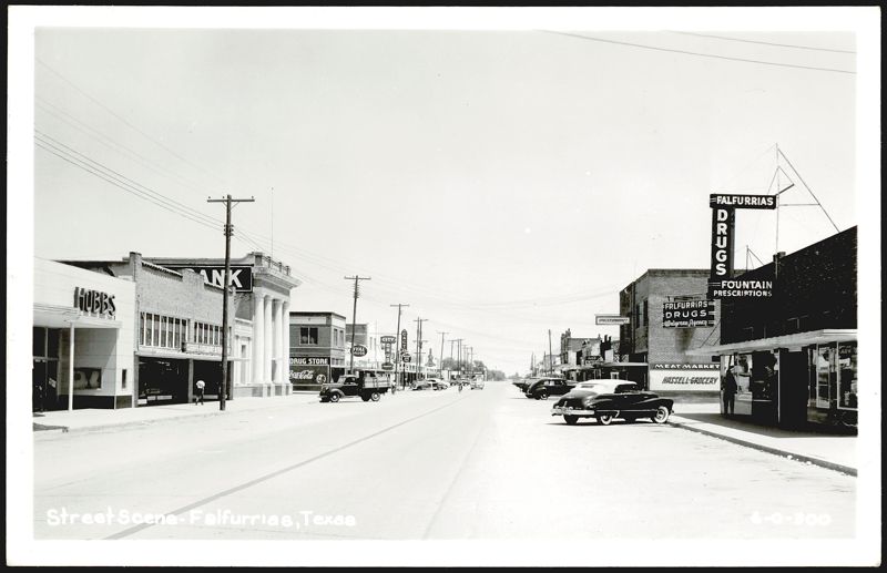 Downtown Street Scene with Businesses and Cars, Falfurrias Texas
