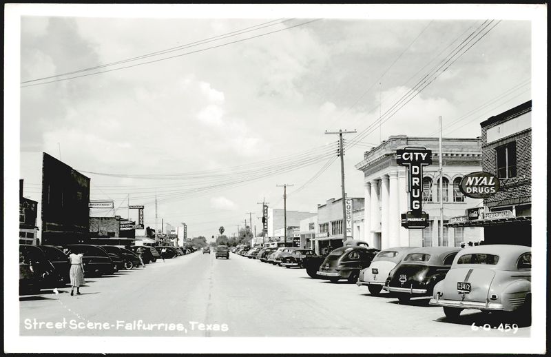 Main Street with Cars and Businesses Falfurrias Texas