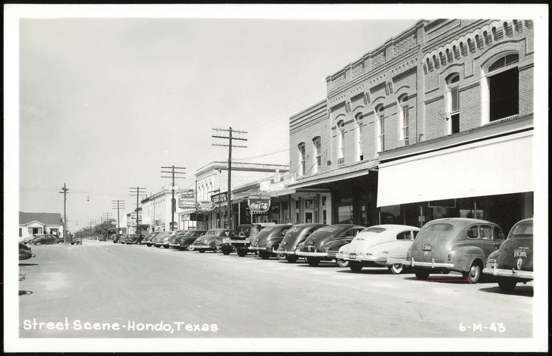 Street Scene with Parked Cars and Businesses Hondo Texas