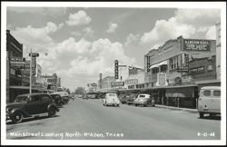 Main Street Looking North, McAllen, Texas with Vintage Cars and Shops Postcard