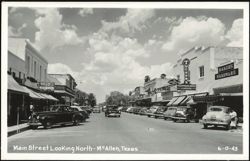 Main Street Looking North with Businesses and Parked Cars Postcard