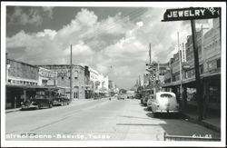 Street Scene with Businesses and Vintage Cars Postcard