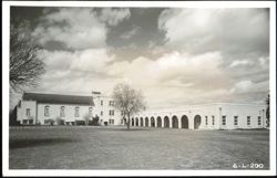 Building Complex with Church-like Structure and Arched Facade Postcard