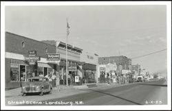 Lordsburg, NM Street Scene with Businesses and Cars Postcard