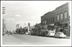 Downtown Street Scene with Businesses and Cars Postcard