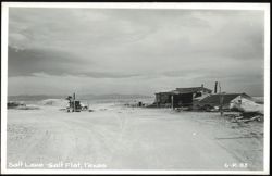 Arid Landscape of Salt Lake and Salt Flat with Buildings Postcard