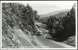 A Mountain Highway near Salyersville with two buses Postcard
